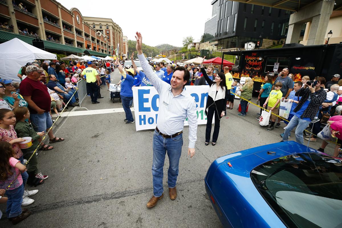 Democratic gubernatorial candidate Adam Edelen waved to supporters during a parade along Hambley Boulevard during Hillbilly Days in downtown Pikeville.