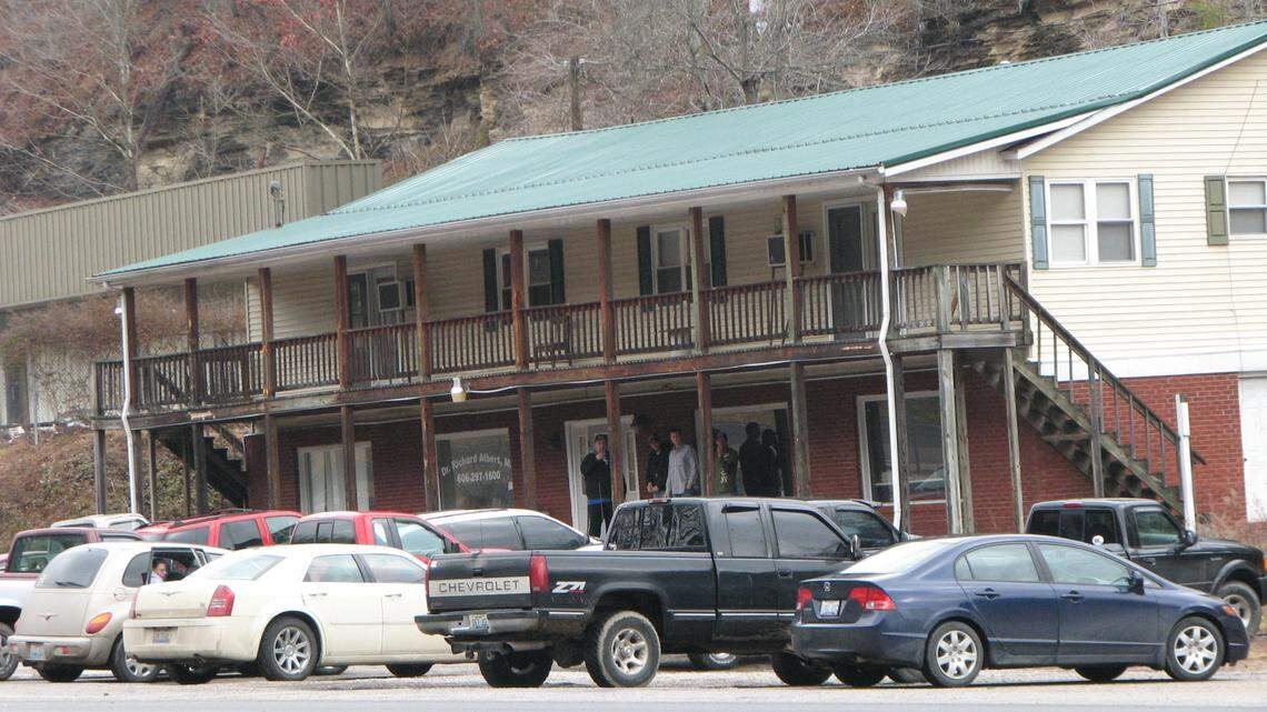 Waiting patients smoked outside Dr. Richard Albert's pain management clinic in Paintsville in 2011. Albert was sentenced Wednesday to more than six years in prison for dispensing thousands of prescription painkillers.