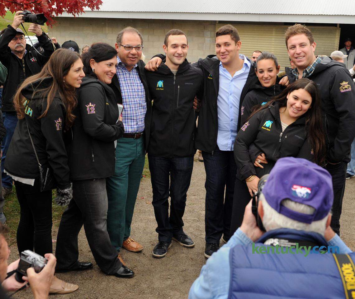 The Zayat family, owners of Triple Crown and Breeders’ Cup Classic champion, American Pharoah, pose for photographs at his barn in 2015.