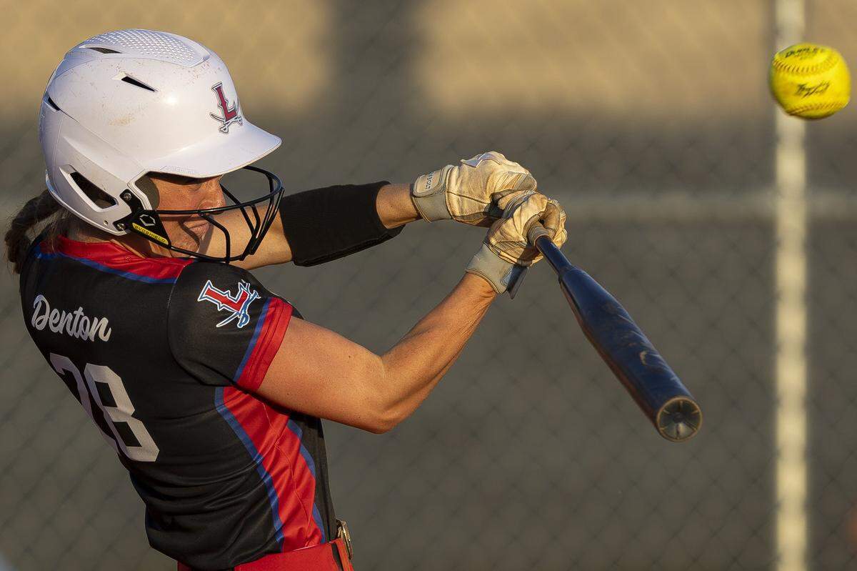 Lafayette's Anna Clay Denton hits the ball during a game against Frederick Douglass at Frederick Douglass High School in Lexington, Ky., on Tuesday, April 14, 2026.
