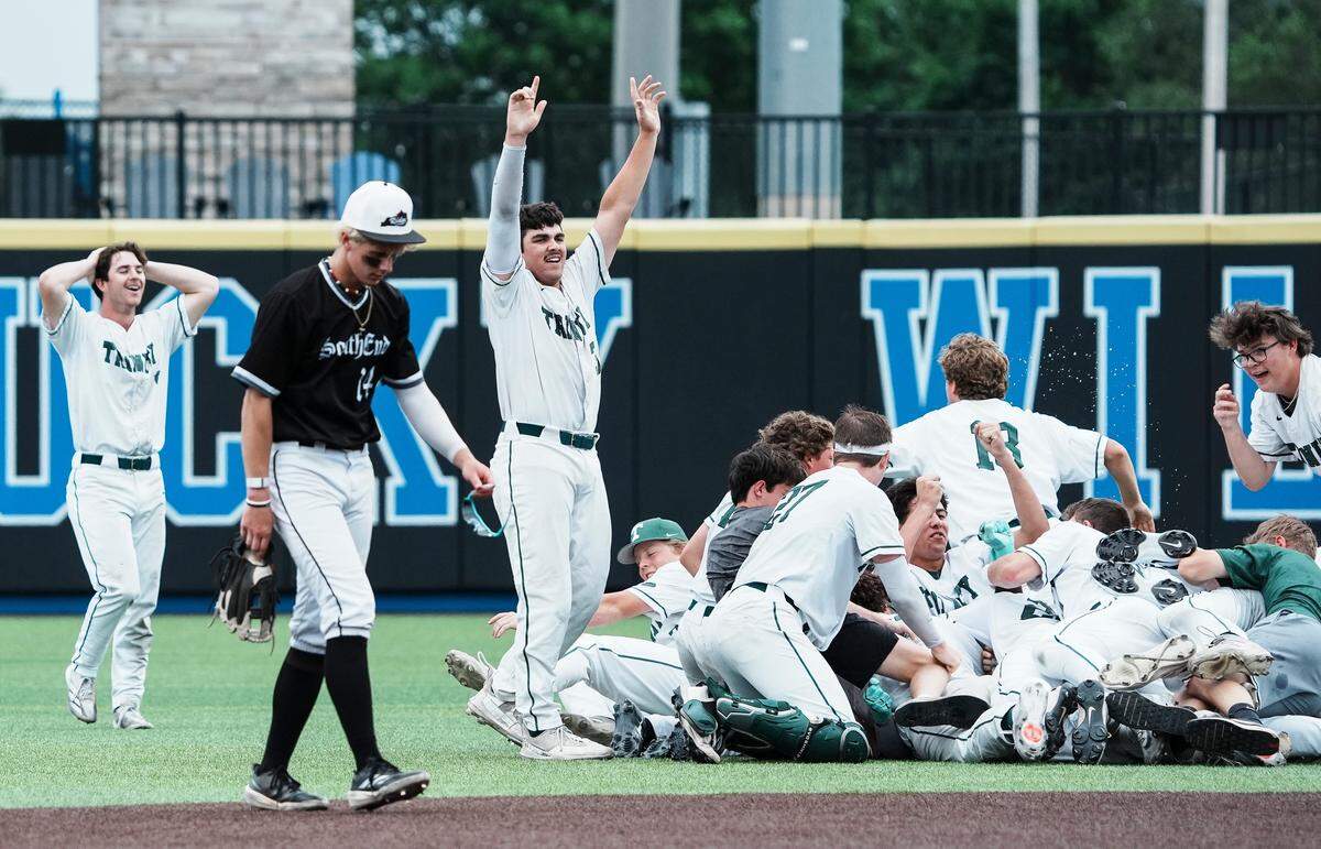 The Trinity Shamrocks baseball team celebrate after Caleb Ricks hit an RBI to beat PRP 2-1 in the 2025 KHSAA Boys Baseball state championship in Lexington, Kentucky Saturday, June 14, 2025.