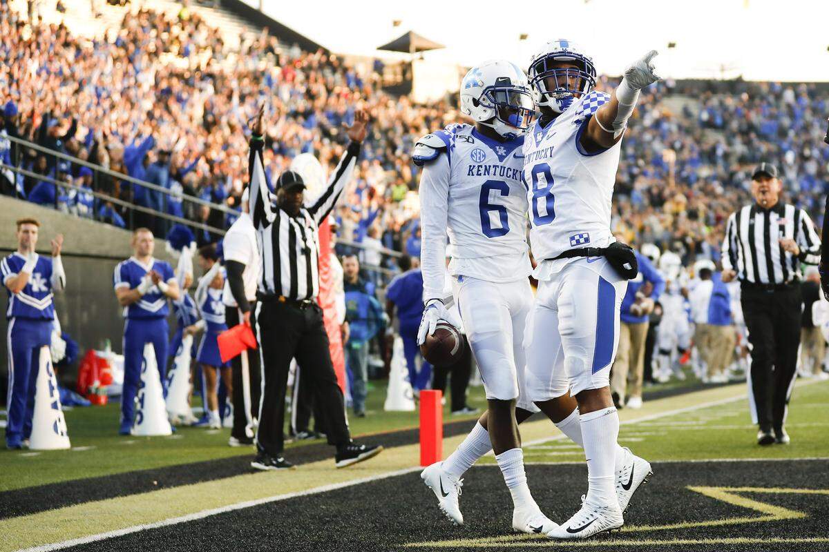 Kentucky wide receiver Josh Ali (6) celebrated a touchdown with teammate Clevan Thomas (18) during UK’s 38-14 win at Vanderbilt.