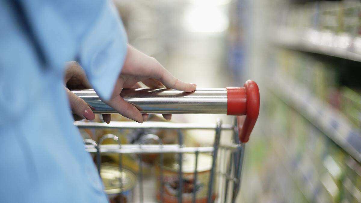 A woman shops for groceries in this stock image.