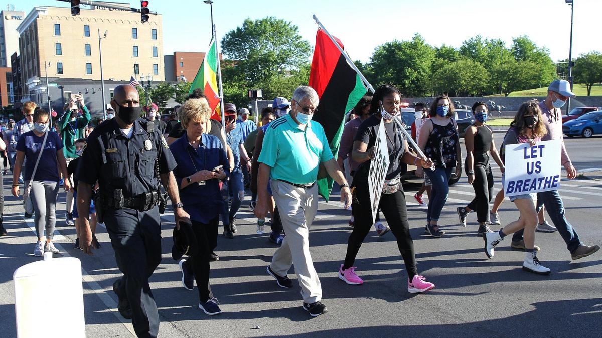 Lexington Police Chief Lawrence Weathers, left, and Sheriff Kathy Witt walked with protesters Saturday morning during the Let Us Live March.