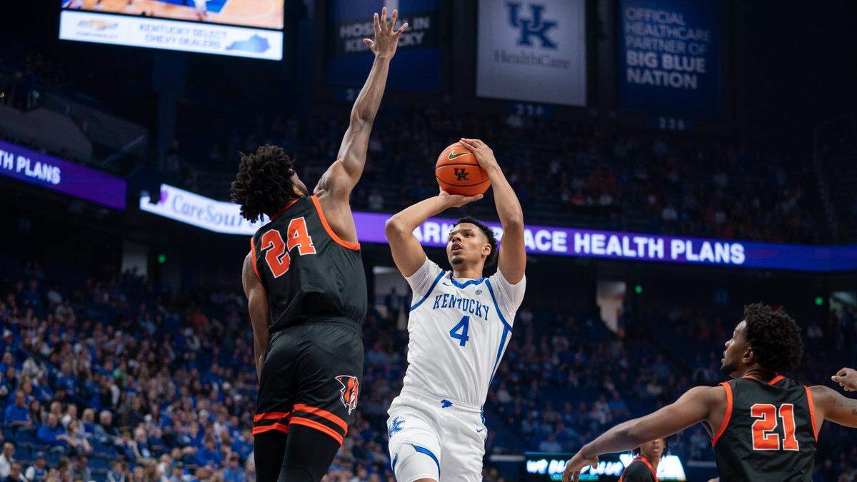 Kentucky’s Tre Mitchell (4) takes a shot against Georgetown College’s Rashad Bishop during Friday’s exhibition game. Mitchell led the Wildcats with 22 points.