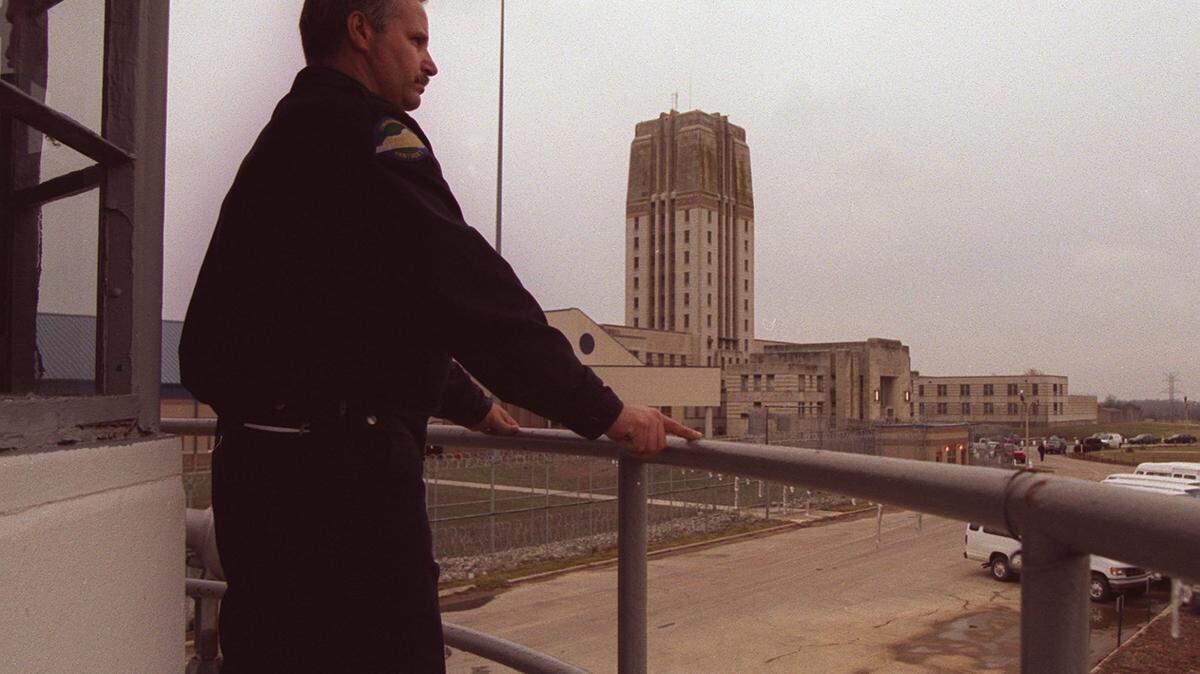 Corrections officer Jim Brown looks out over the grounds from his tower outside the Kentucky State Reformatory  Facility in La Grange, KY on January 19, 1999.