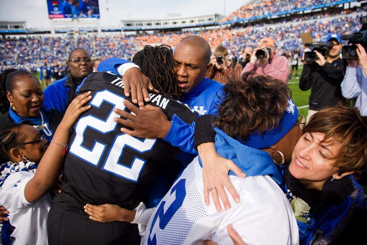 Then-UK coach Joker Phillips hugged senior linebacker Danny Trevathan before Kentucky snapped a 26-game losing streak vs. Tennessee with a 10-7 win over the Volunteers on 2011 Senior Day.