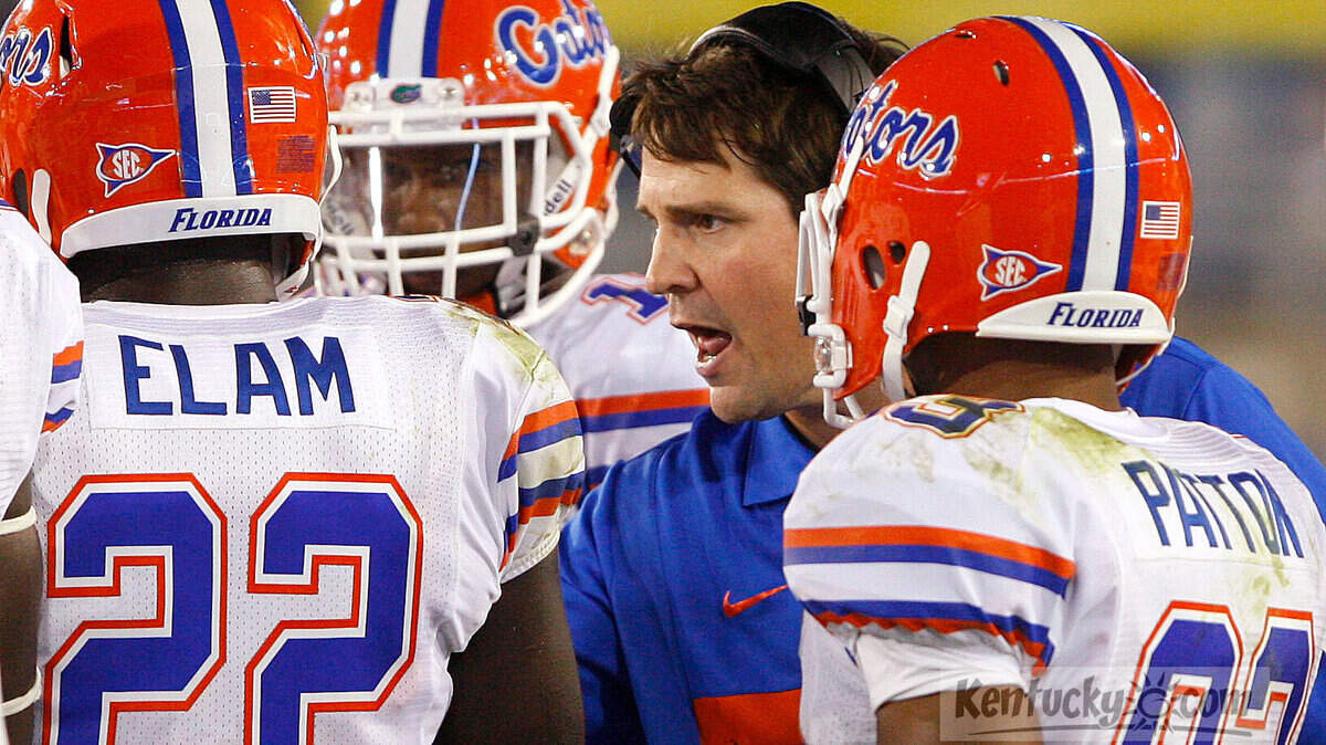 Florida head coach Will Muschamp talked with his players during the first half at Commonwealth Stadium Sept. 24, 2011 in Lexington, Ky. Photo by Amy Wallot
