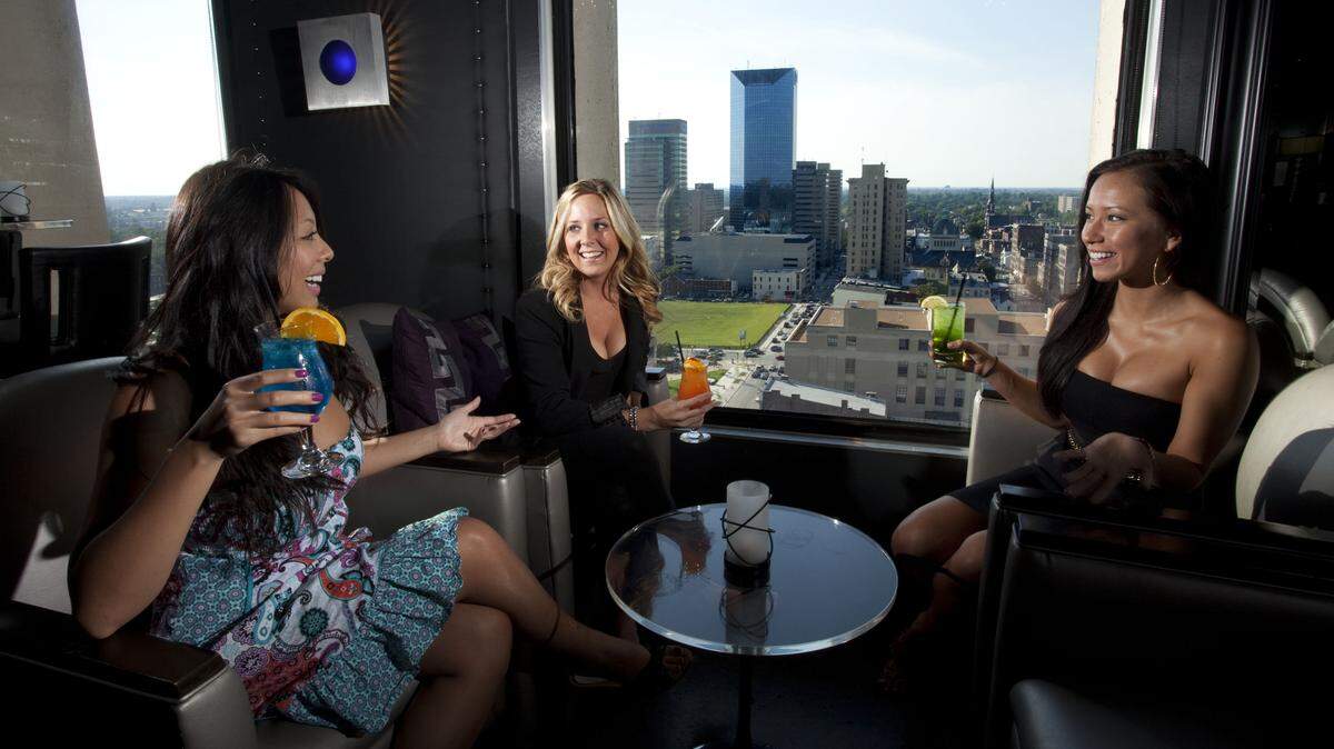 From left, Geraldyne Tiu, Kari Shipp and Hannah Foote had drinks at Bakers 360 last August. Bakers owner Steve Taylor said the venue was popular as a nightclub but it struggled as a restaurant, and state law required more than half of sales to be from food.