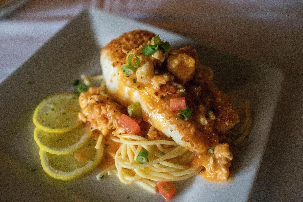 Giuseppe’s oven roasted sea bass with lobster chili butter sauce.