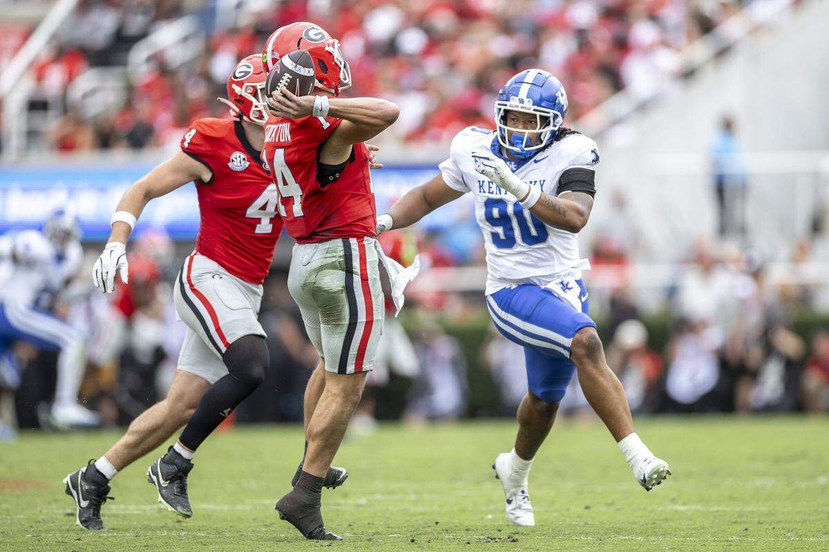 Kentucky’s Mi’Quise Humphrey-Grace (90) pressures Georgia quarterback Gunner Stockton (14) during Saturday’s game.