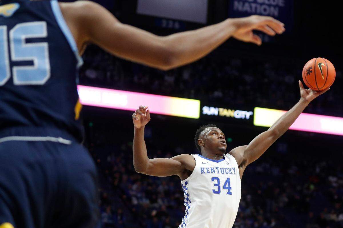 Oscar Tshiebwe, who transferred from West Virginia to Kentucky before this season, leads the nation in rebounds per game at 15.1. He also leads the Wildcats in scoring at 17.0 points per game.