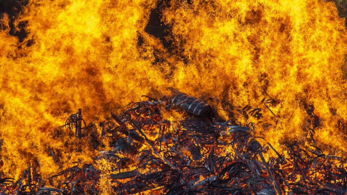 A Jim Beam bourbon warehouse in Woodford County, Ky., burns on Wednesday, July 3, 2019, after catching fire late Tuesday night.