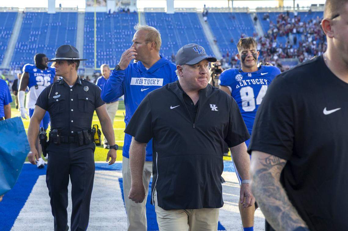 Kentucky head coach Mark Stoops walks off the field after his team’s 31-6 loss to South Carolina at Kroger Field on Saturday.
