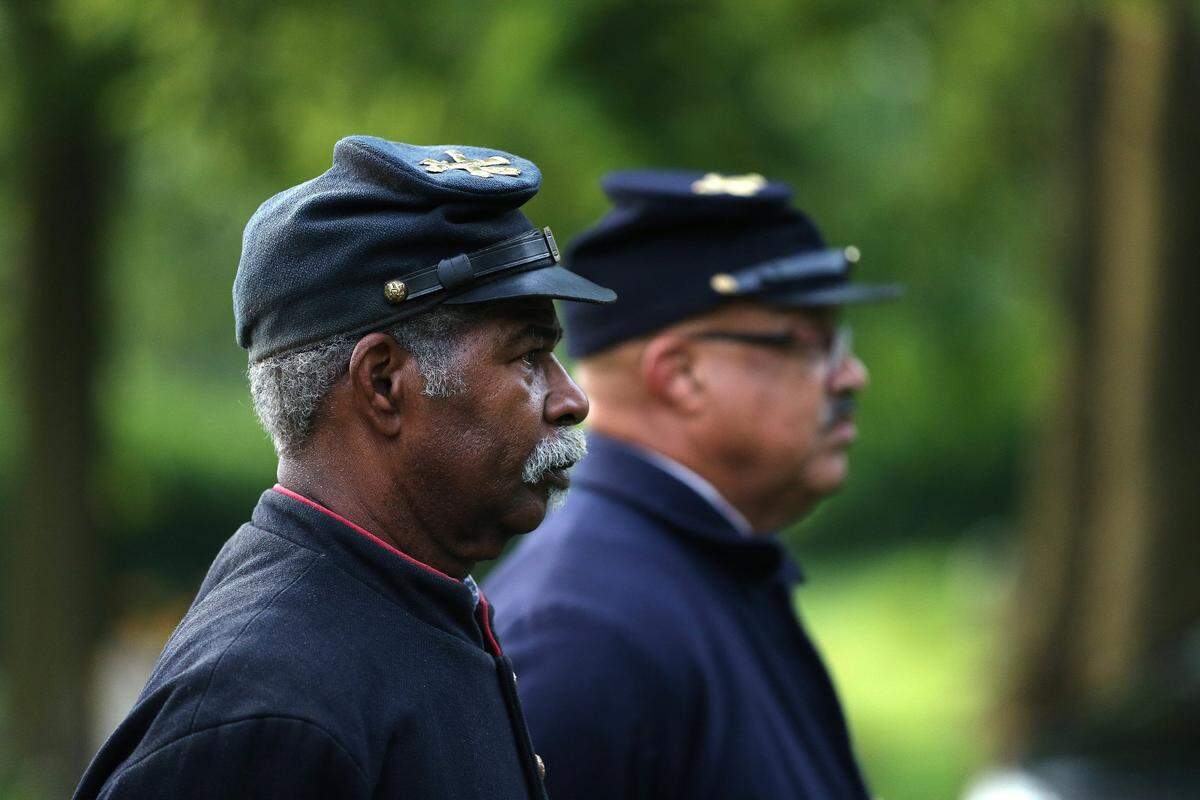 Robert Bell, who has at least one Civil War veteran ancestor buried on site, looked on Saturday evening during the Juneteenth Jubilee at African Cemetery No. 2 on Seventh St. in Lexington. 