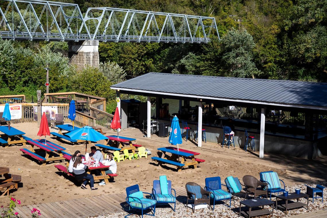 Customers enjoy food and drinks at the outside seating of Proud Mary BBQ in Lexington, Ky., Wednesday, September 30, 2020.