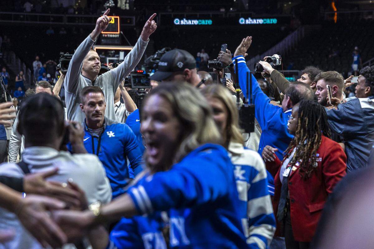 Kentucky head coach Mark Pope gestures to fans after the Wildcats defeated Duke during Tuesday’s game in the Champions Classic at State Farm Arena in Atlanta.