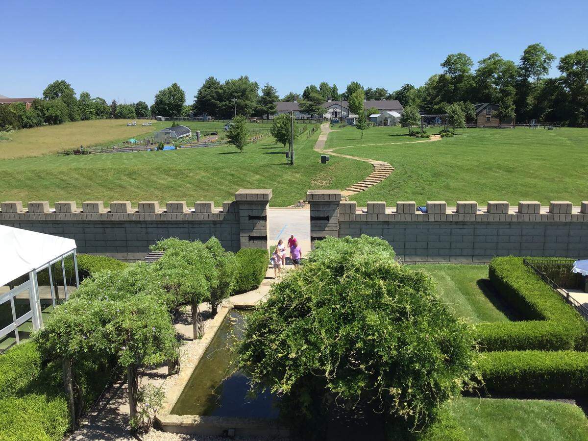 Visitors in the garden behind the Kentucky Castle in Versailles on June 3, 2026.