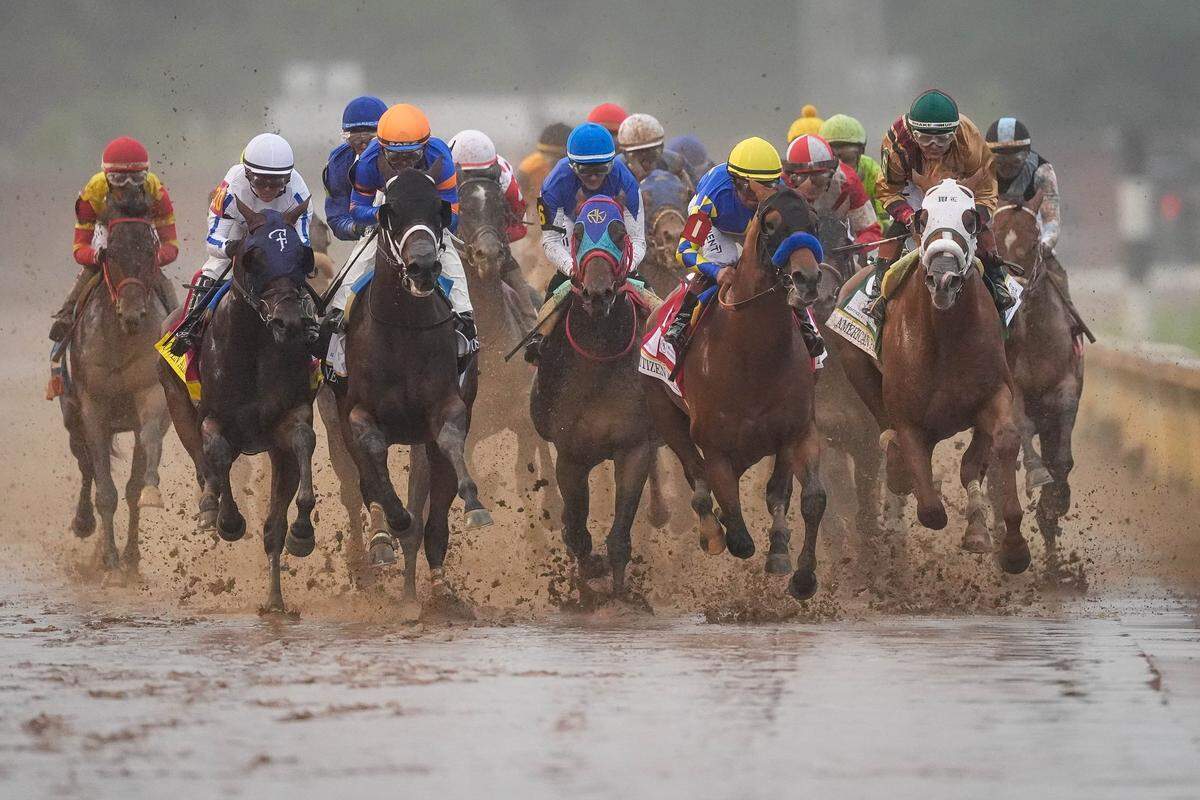 The 19-horse field heads toward the first turn during the 151st running of the Kentucky Derby at Churchill Downs, in Louisville, Kentucky, Saturday, May 3, 2025.