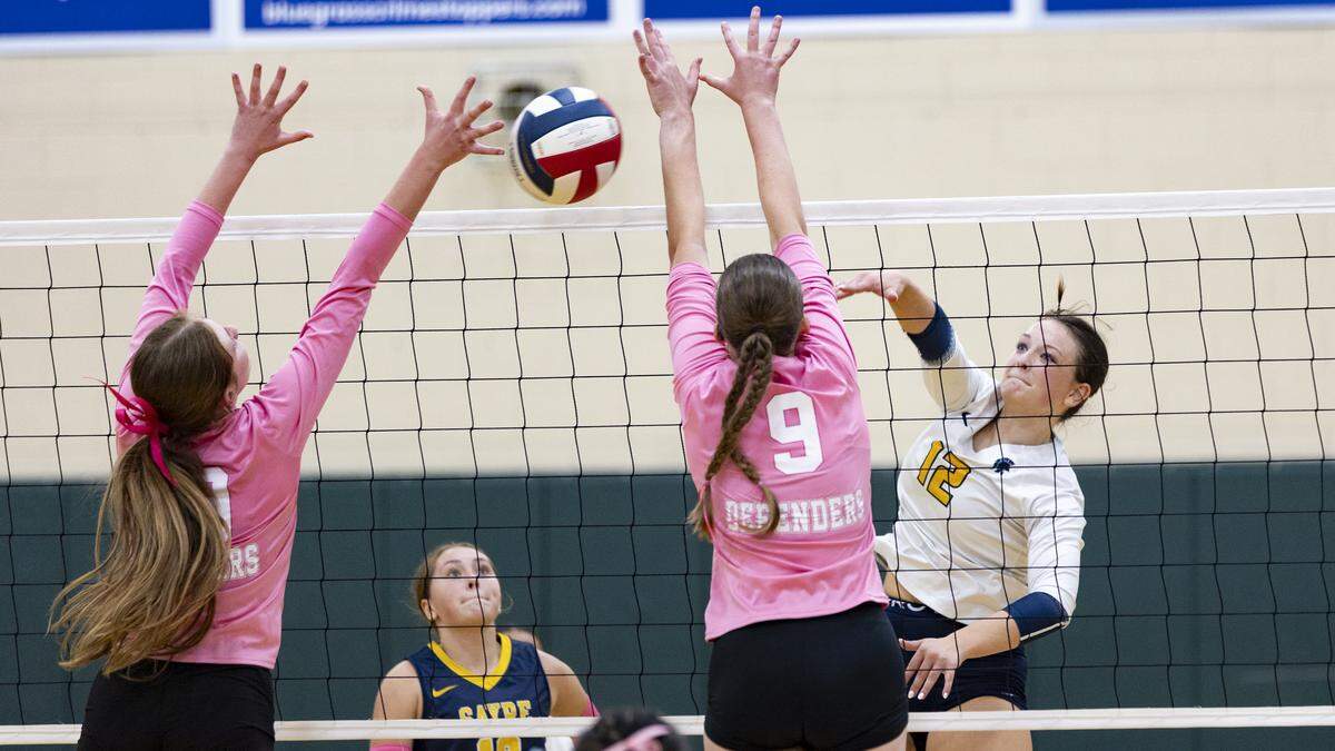 Sayre’s Eli Powell delivers the match-winning kill in the Spartans’ five-set win at Bryan Station on Tuesday.
