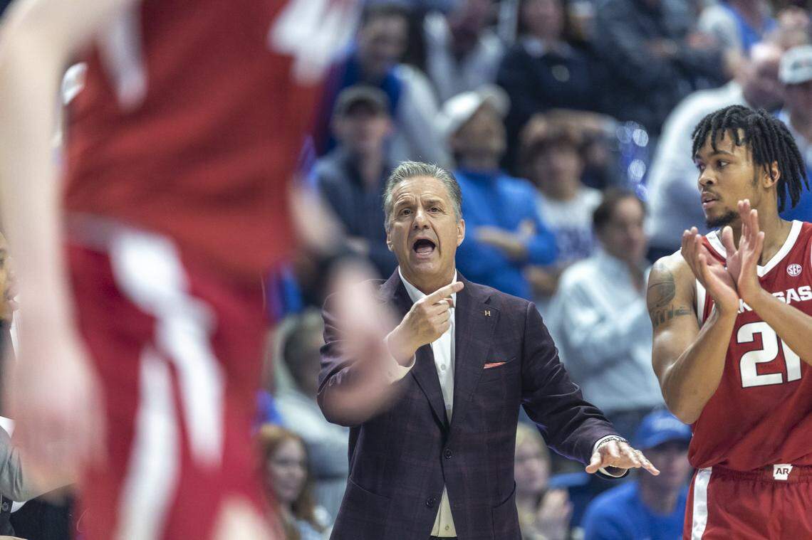 Arkansas head coach John Calipari talks to his players during Saturday’s game at Rupp Arena.