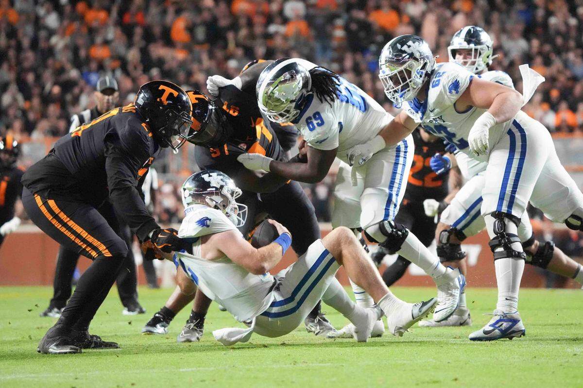 Kentucky quarterback Brock Vandagriff (12) is sacked during a game between Tennessee and Kentucky at Neyland Stadium in Knoxville, Tenn., Saturday, Nov. 2, 2024.