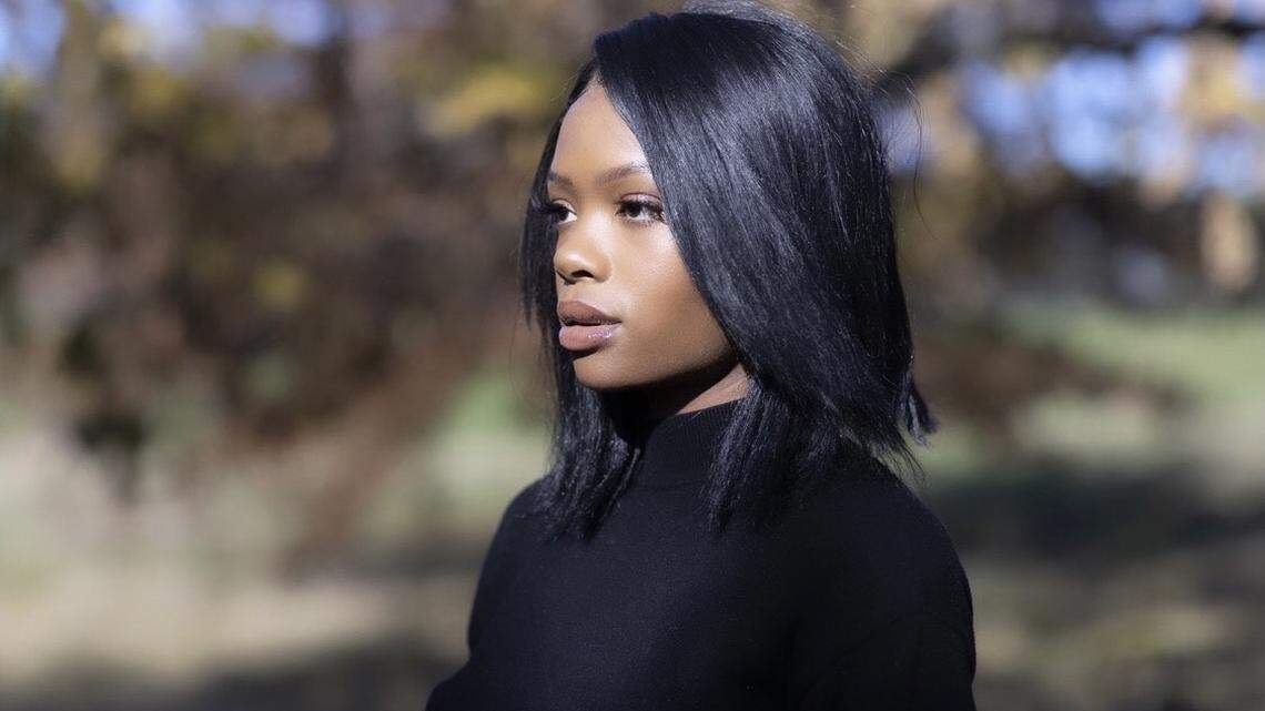 Marie Emedi poses for a portrait at Castlewood Park in Lexington, Ky., on Thursday, Nov. 12, 2020.