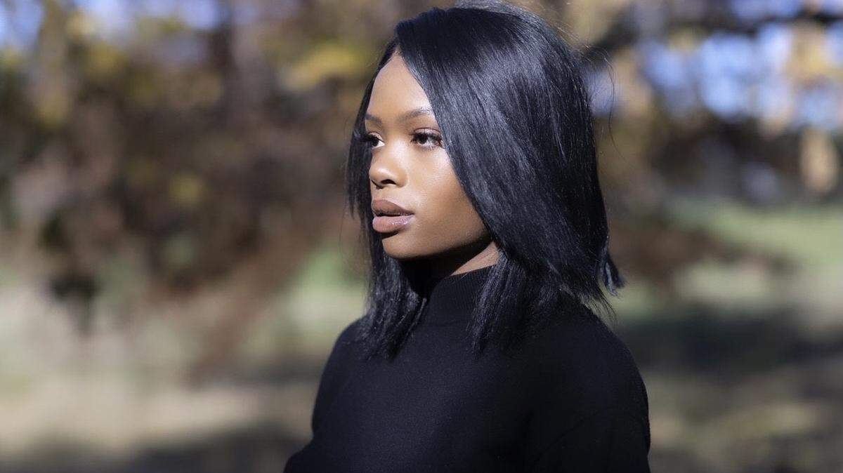 Marie Emedi poses for a portrait at Castlewood Park in Lexington, Ky., on Thursday, Nov. 12, 2020.