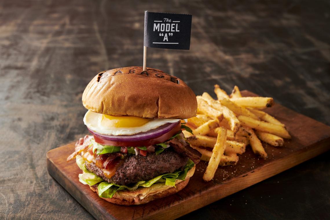 The Model “A” burger ($16.50) at Ford’s Garage comes with sharp cheddar cheese, applewood smoked bacon, pico de gallo, arugula, lettuce, tomato, red onion and a sunny side up egg on a brioche bun.