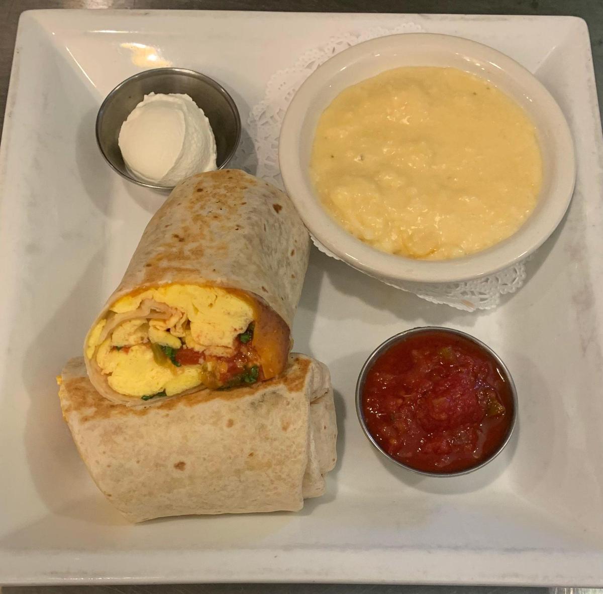 The Breakfast Burrito is a Tack House Pub favorite on the breakfast menu. It comes with a choice of pub potatoes or cheese grits.