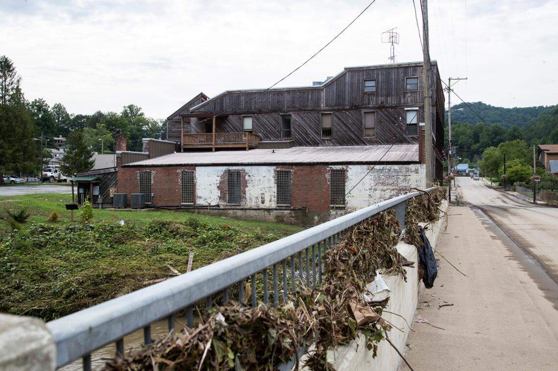 Debris sit piled up on and around a bridge over the North Fork of the Kentucky River where Appalshop sits on the bank in Whitesburg, Ky., Saturday, July 30, 2022.