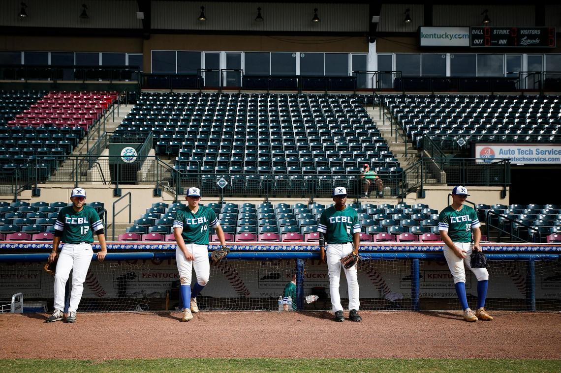 Xpress Green team players from left, Chris O’Neal (Georgetown College), Dahlton Cash (Young Harris), Royce Brittentime (Pikeville) and Evan Byers (Kentucky) socially distanced from one another during warm-ups before their Commonwealth Collegiate Baseball League game at Whitaker Bank Ballpark in Lexington on Tuesday night.