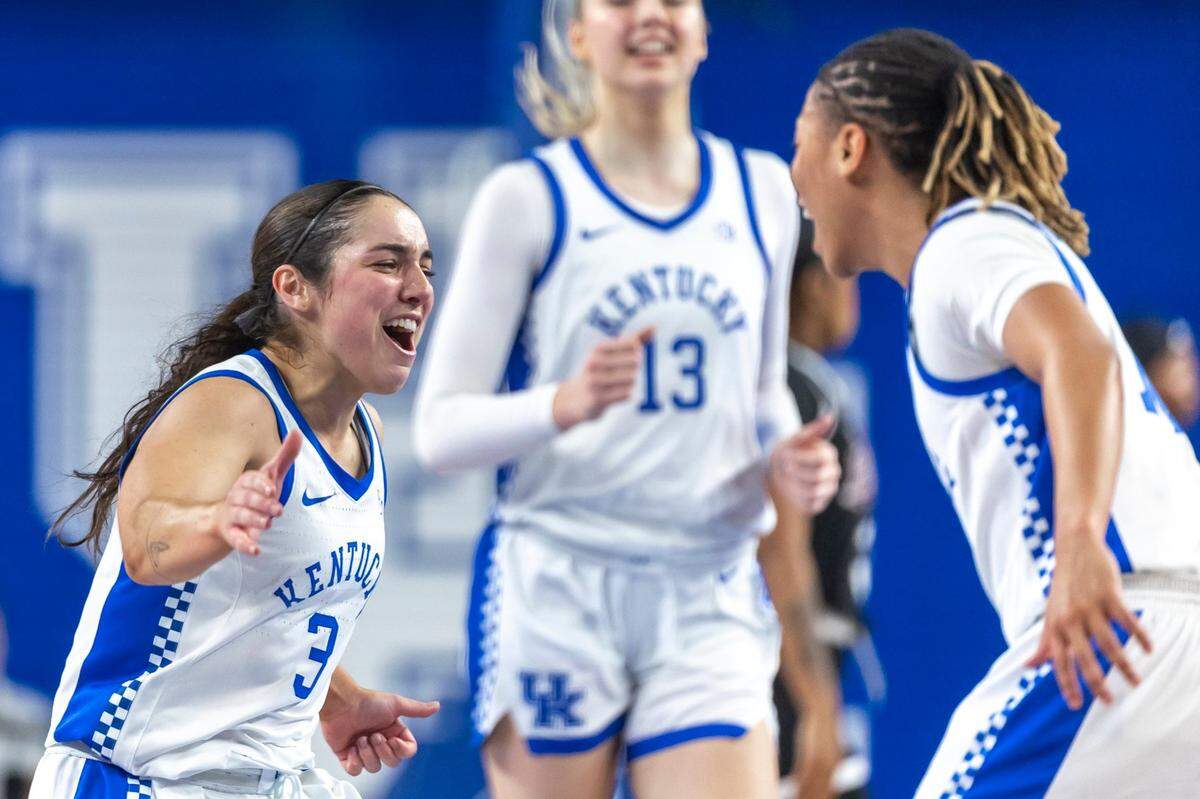 Kentucky’s Georgia Amoore (3), left, celebrates with Dazia Lawrence (10) after scoring a basket during a game against Mississippi State at Memorial Coliseum on Jan. 2.