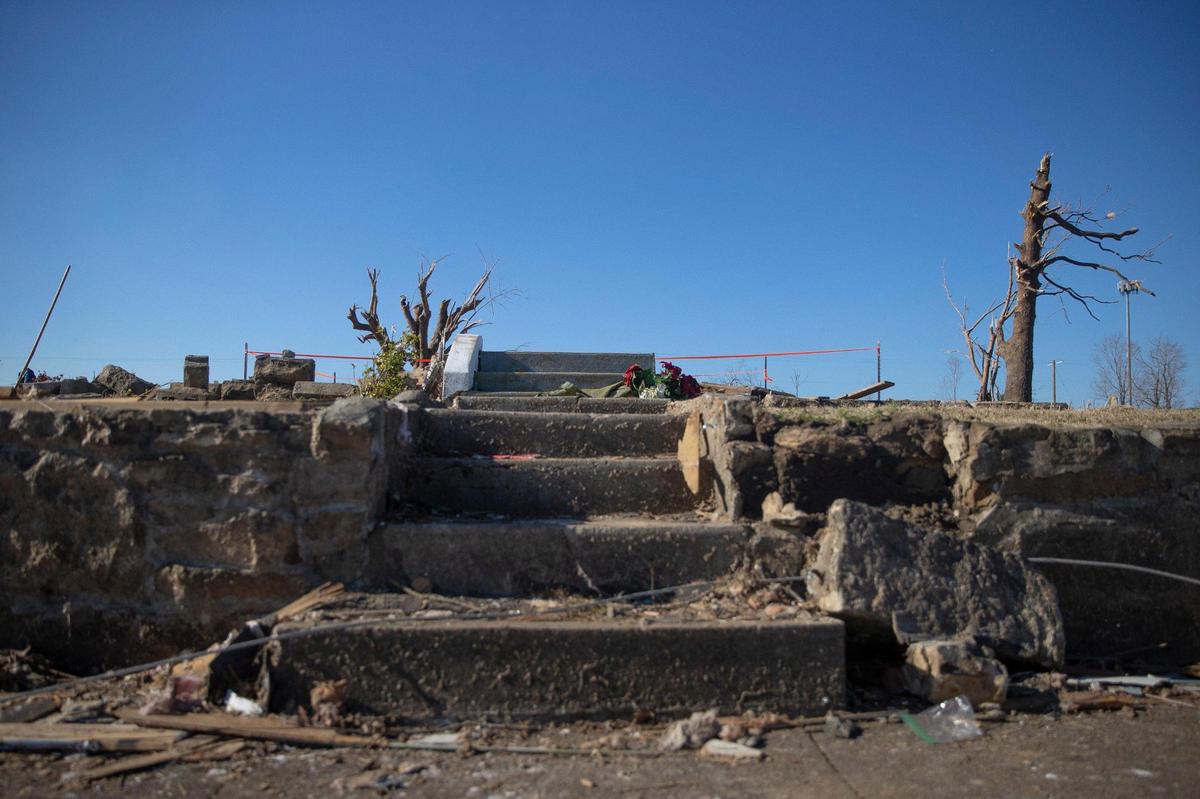Steps lead to an empty plot where a home once stood in Dawson Springs, Ky., before it was destroyed by a tornado on Friday, Dec. 10, 2021.