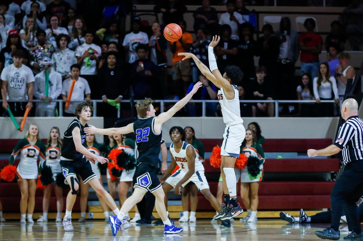 Armelo Boone makes a three-point basket to give Frederick Douglass the lead with 13.3 seconds left, and the Broncos went on to defeat Lexington Catholic in Richmond on Monday night.