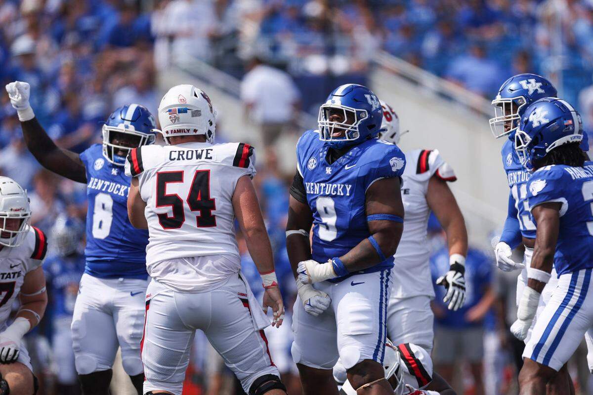Kentucky defensive lineman Keeshawn Silver (9) celebrates a tackle for loss against Ball State during Saturday’s game at Kroger Field.