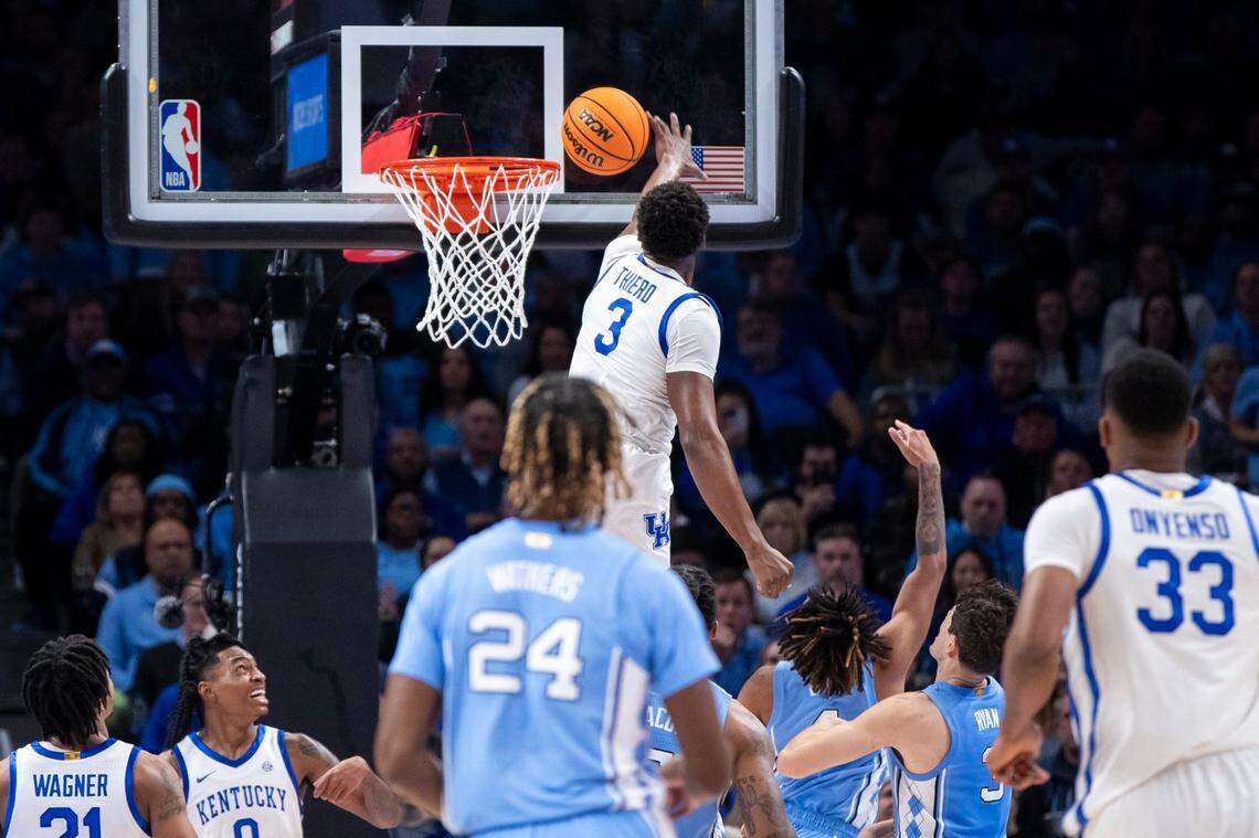 Kentucky’s Adou Thiero (3) blocks a shot by North Carolina’s RJ Davis (4) during the CBS Sports Classic in Atlanta.