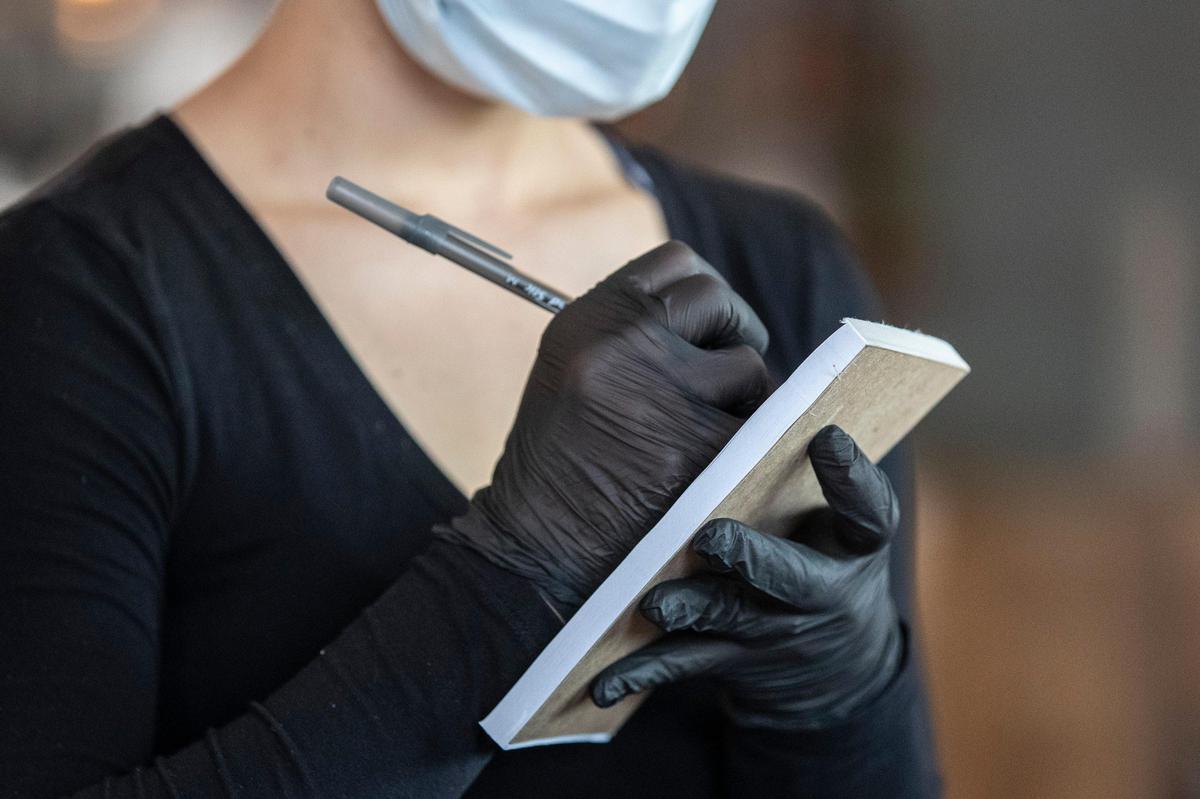 Server Makezie Black takes an order at First Watch.