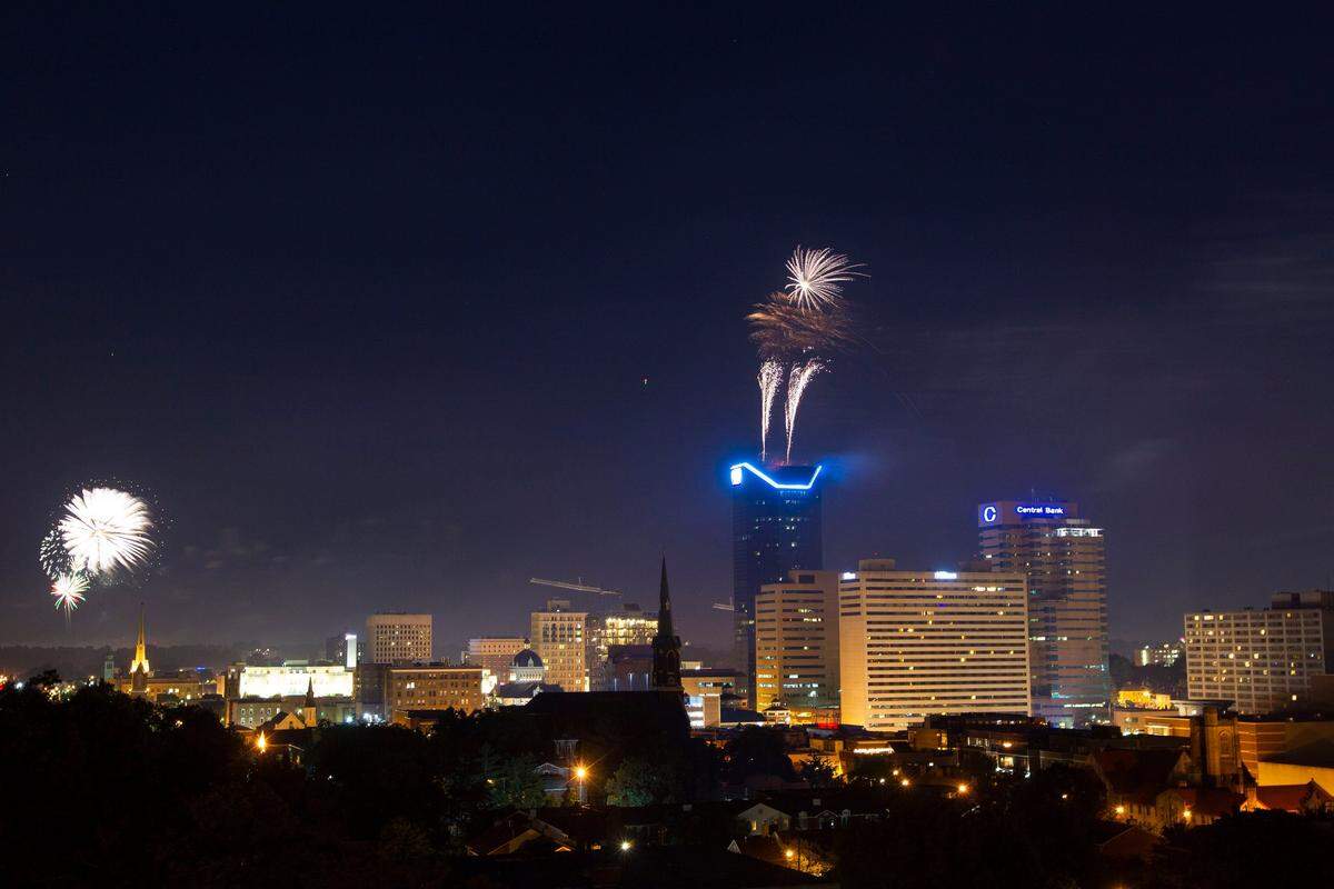 View of downtown Lexington during the city’s Fourth of July fireworks as seen from the roof of the Connie Griffith Tower.