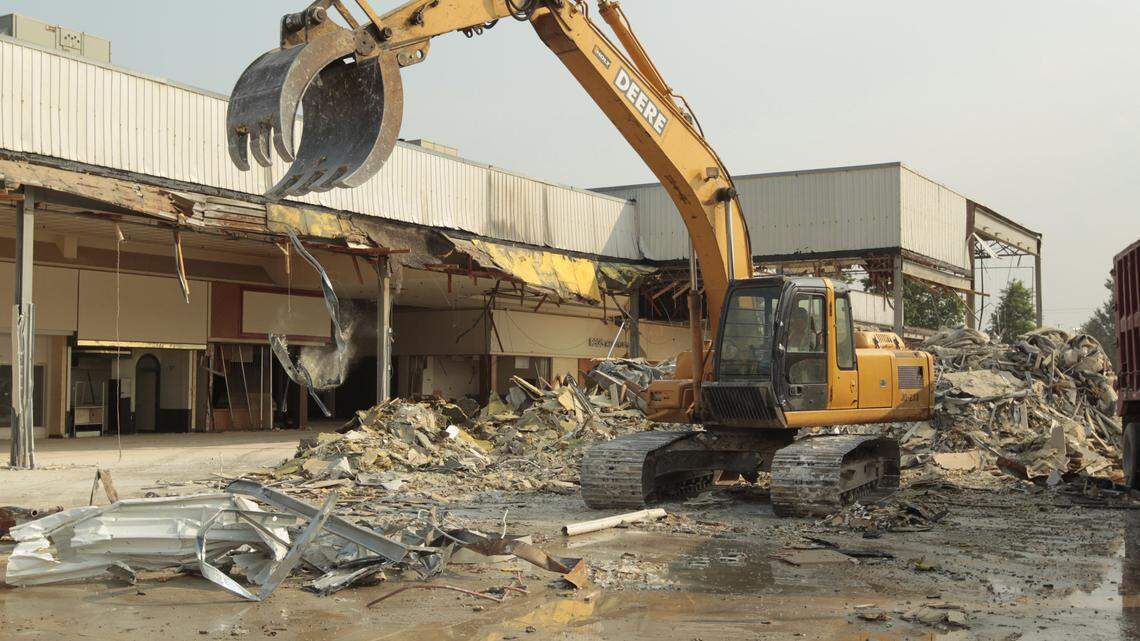 Superior Demolition continued with its demolition project at Lexington Mall on Friday. The company tears down and sorts the debris into piles for recycling or dumping. Masonry material will be crushed for use in the site's parking lot.  