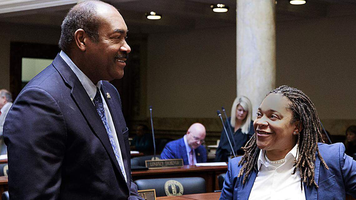 Sen. Donald Douglas, R-Nicholasville, confers with Sen. Keturah Herron, D-Louisville, on the Senate floor before the start of the 2025 legislative session.