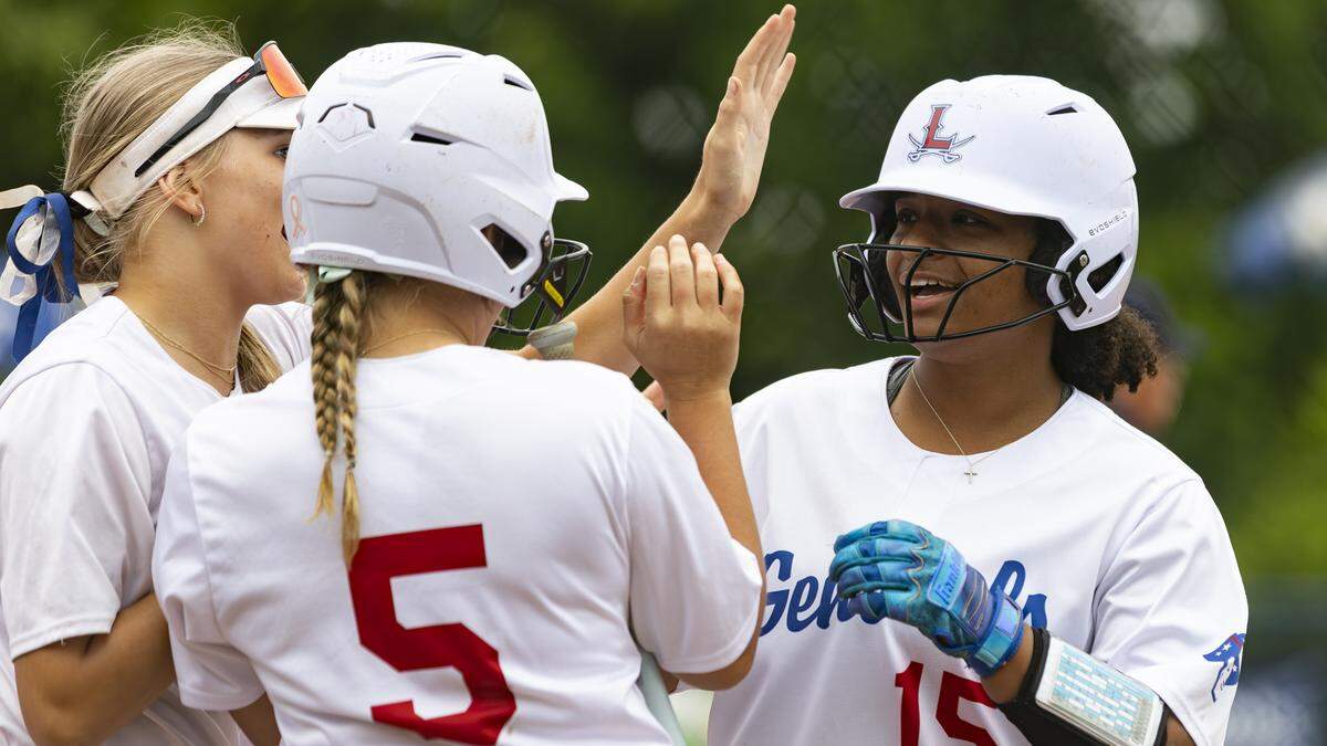 Lafayette’s Brynna Harris, right, steps on home plate as her teammates greet her following her solo home run in the bottom of the first inning of the Generals’ 4-1 win in the 43rd District Softball Tournament final at Lafayette High School on Thursday.