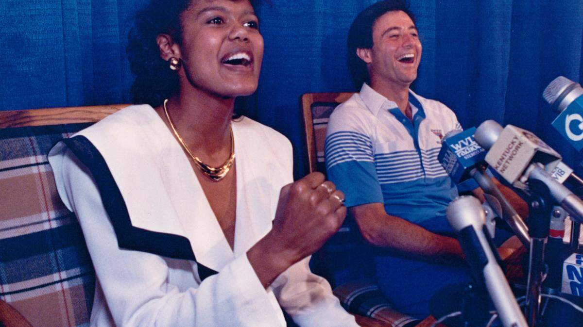 Bernadette Locke and Rick Pitino laughed during her 1990 introductory news conference as a member of the UK men's basketball staff.

  