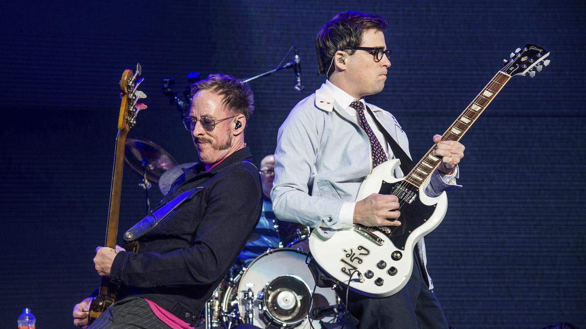 Scott Shriner, left, and Rivers Cuomo of Weezer will be on stage at Riverbend in Cincinnati July 6.