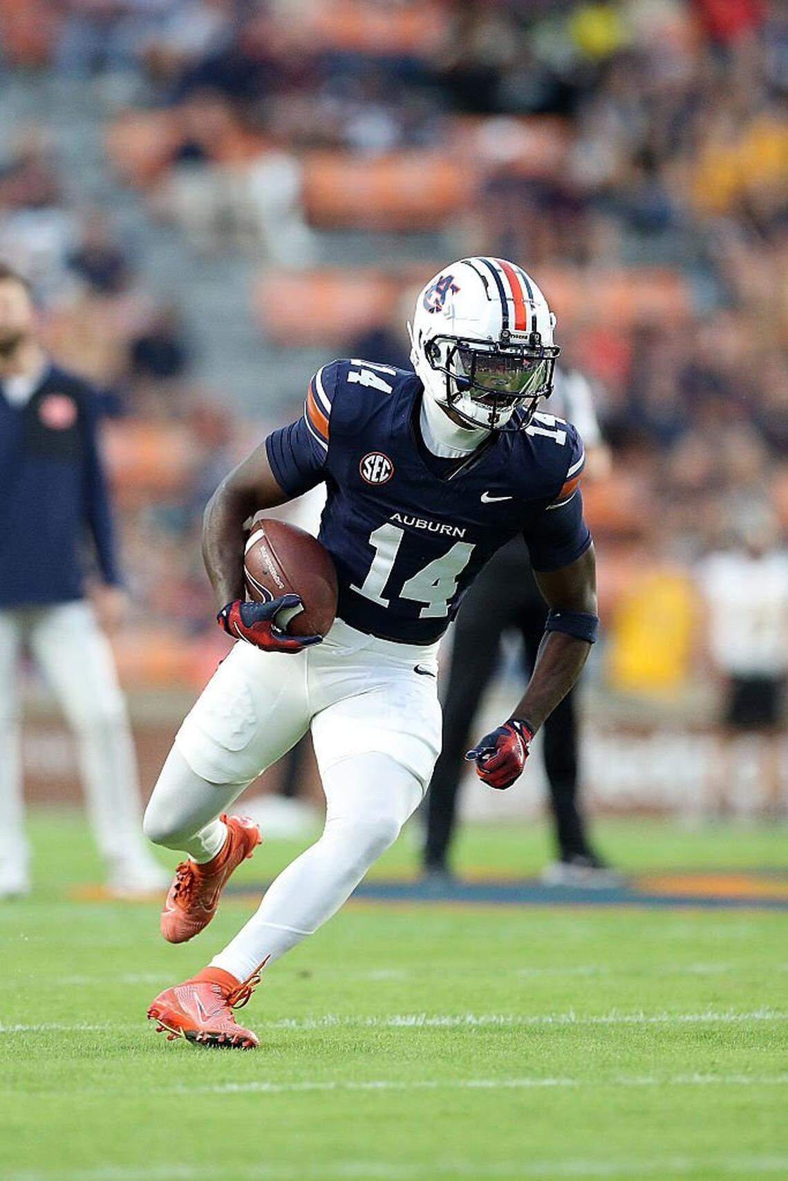 Auburn cornerback Rayshawn Pleasant (14) put the Tigers ahead to stay in the fourth quarter of Auburn’s 33-24 win at Arkansas by returning an interception 49 yards for a touchdown.