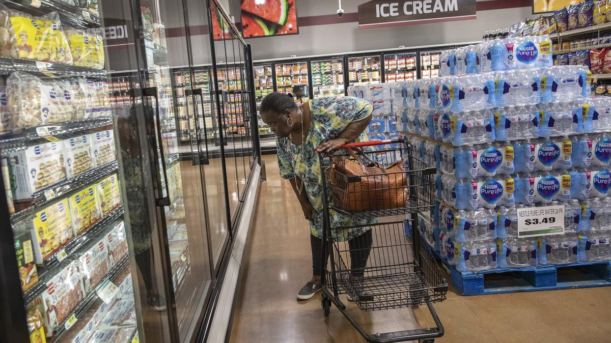 Jamie Richardson, of Lexington, shops at the new Crossroads IGA on Leestown Road on Wednesday, April 24, 2019.