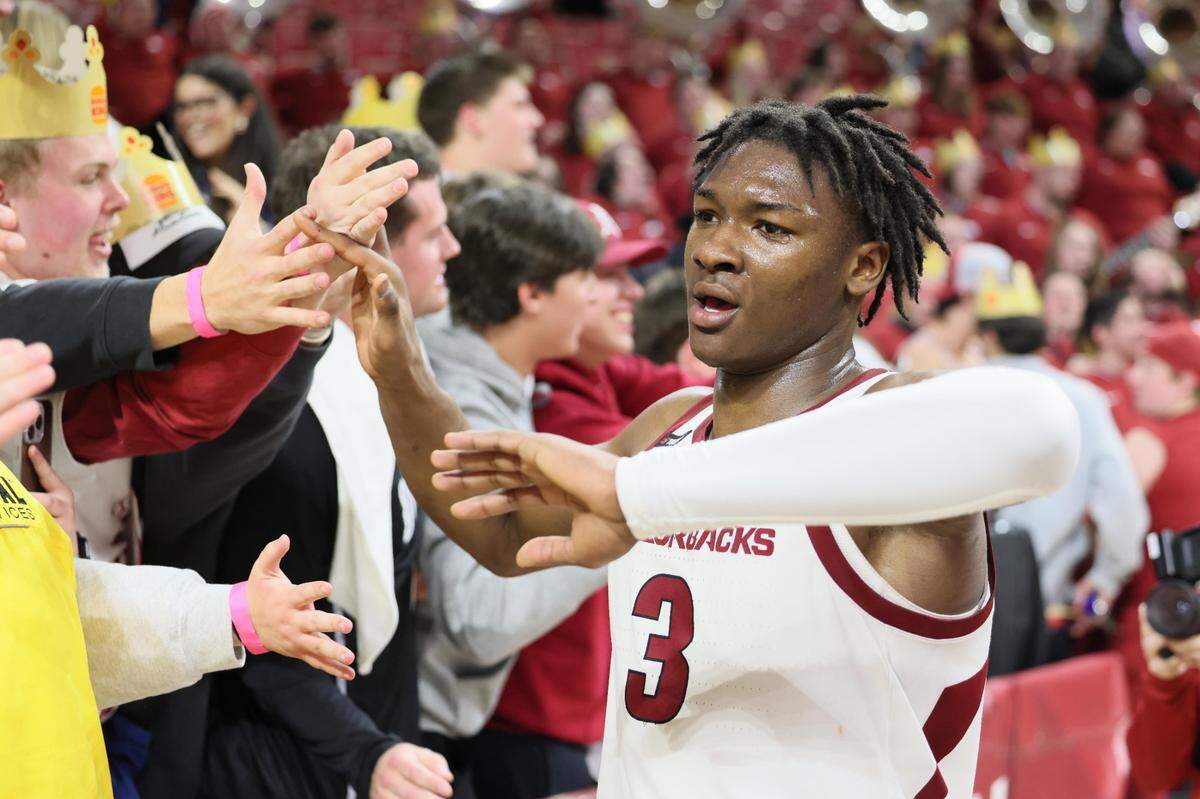 Adou Thiero celebrated with Arkansas fans after leading the Razorbacks to a win over Georgia for their first SEC victory last week.