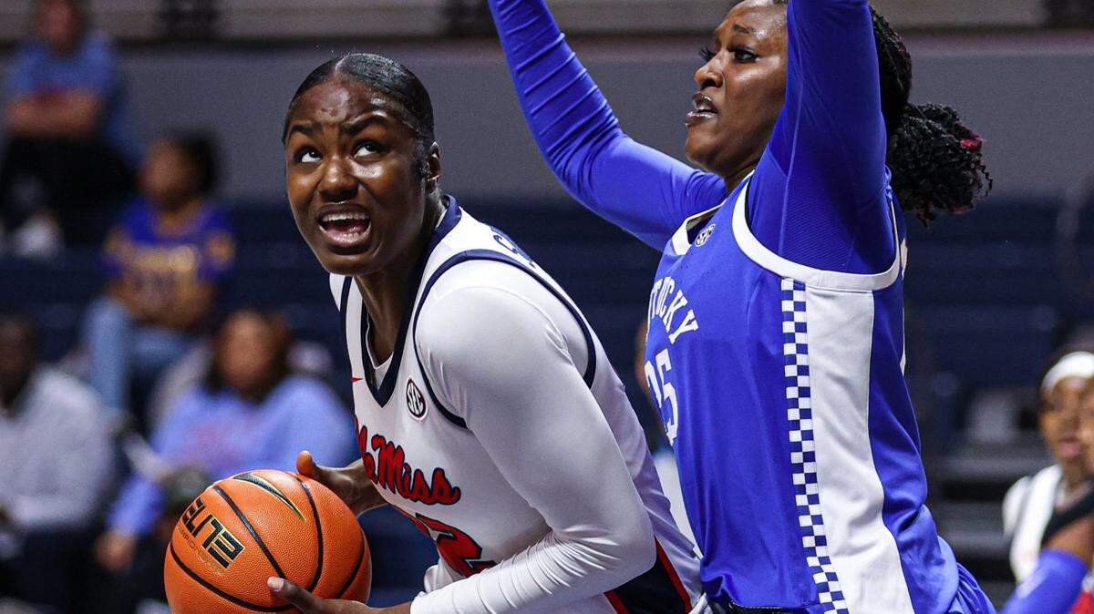 Tyia Singleton of Ole Miss maneuvered around Kentucky’s Adebola Adeyeye for a putback basket during the first half Monday night in Oxford, Miss. Mississippi outrebounded UK 52-31 and outscored the Wildcats 16-3 in second-chance points.