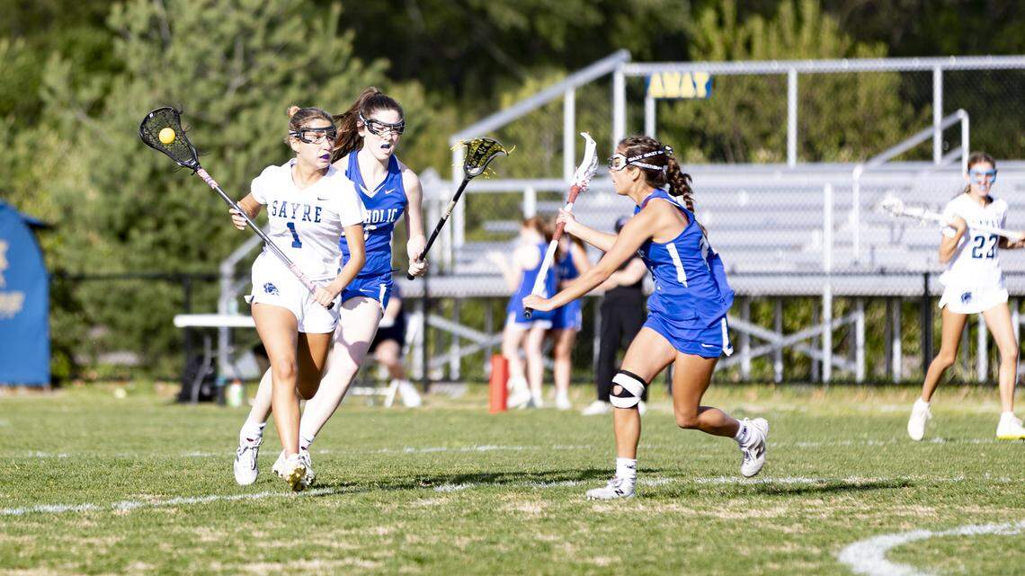 Sayre’s Danica Porter (1) navigates Lexington Catholic’s defense during the first half of the Spartans’ 10-5 win over Lexington Catholic as the Sayre Athletic Complex on Thursday.