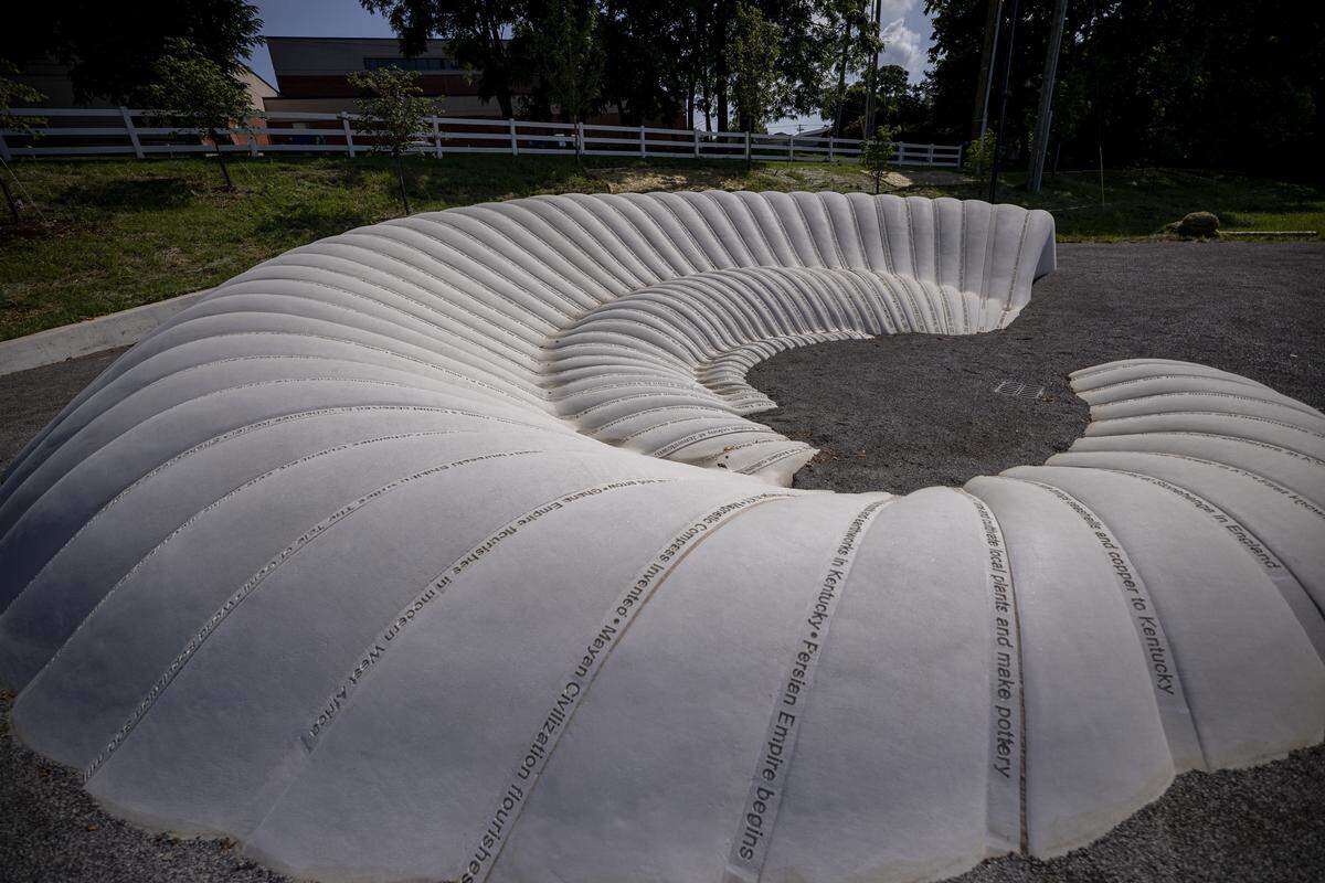 The sculpture, First Impressions, during a tour on Thursday, Aug. 14, 2025, at Gatton Park on the Town Branch in Lexington, Ky.
